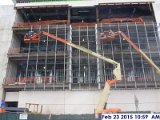 Installing weather strips throughout the Curtain Wall South Elevation.jpg